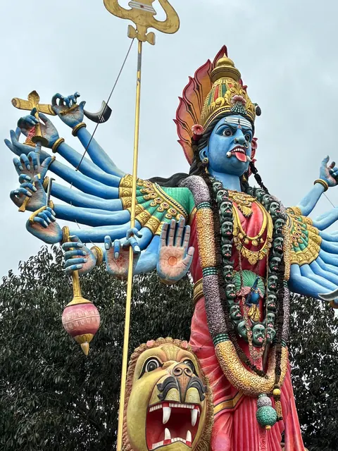 Tall statue of Kali Devi with her lion